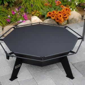3' Cottager fire pit with a table top near a garden