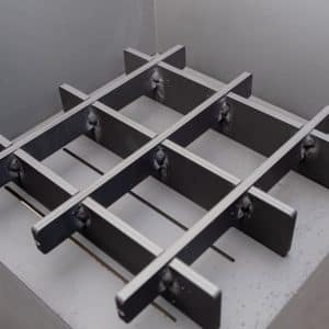 Mini fire grate in a square fire pit