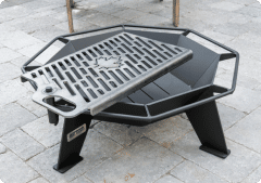 Steel BBQ Grill plate over a small steel fire pit