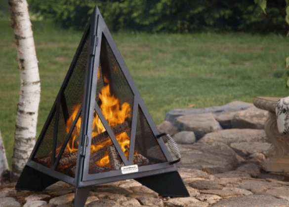 Pyramid fire pit burning on a stone base.