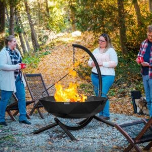 People using hanging fire pit in the fall