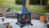 Handcrafted chiminea outdoor fireplace on a stone patio