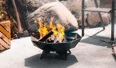 Small polygon fire bowl burning on a patio