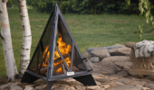 small pyramid shaped fire pit on a picturesque patio setting