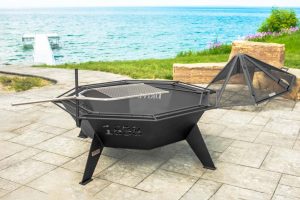 A custom outdoor fire pit with a grill and spark screen